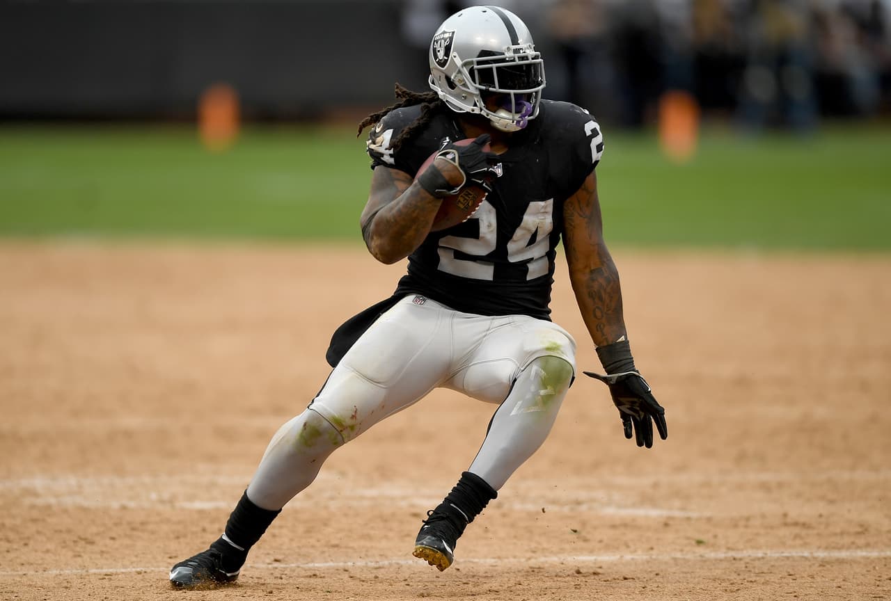 Marshawn Lynch #24 of the Oakland Raiders runs with the ball against the Cleveland Browns during overtime of their NFL football game at Oakland-Alameda County Coliseum on September 30, 2018 in Oakland, California.
