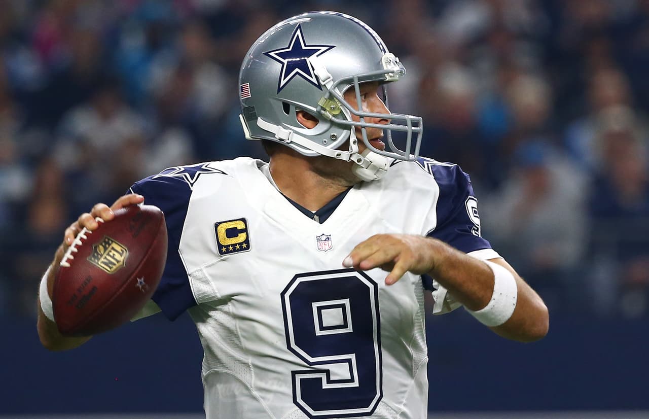 ARLINGTON, TX - NOVEMBER 26: Tony Romo #9 of the Dallas Cowboys looks to throw against the Carolina Panthers in the first quarter at AT&T Stadium on November 26, 2015 in Arlington, Texas. (Photo by Tom Pennington/Getty Images)