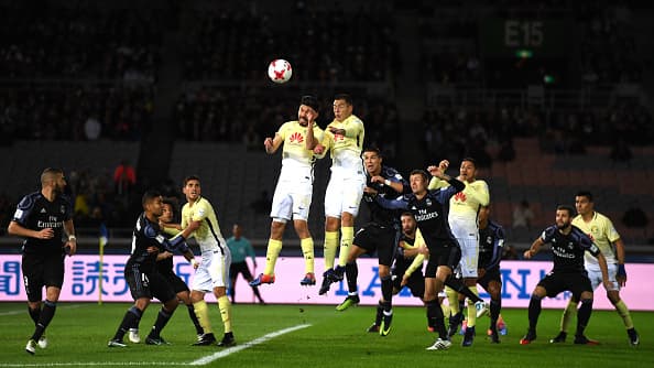YOKOHAMA, JAPAN - DECEMBER 15: Pablo Aguilar of Club America and Oribe Peralta of Club America jump to win a header during the FIFA Club World Cup Semi Final match between Club America and Real Madrid at International Stadium Yokohama on December 15, 2016 in Yokohama, Japan. (Photo by Mike Hewitt - FIFA/FIFA via Getty Images)
