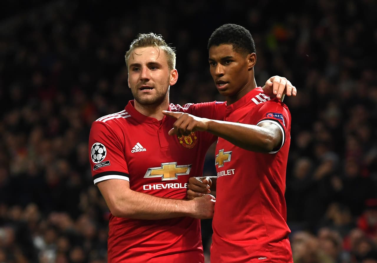 MANCHESTER, ENGLAND - DECEMBER 05: Marcus Rashford of Manchester United celebrates after scoring his sides second goal with Luke Shaw of Manchester United during the UEFA Champions League group A match between Manchester United and CSKA Moskva at Old Trafford on December 5, 2017 in Manchester, United Kingdom. (Photo by Gareth Copley/Getty Images)