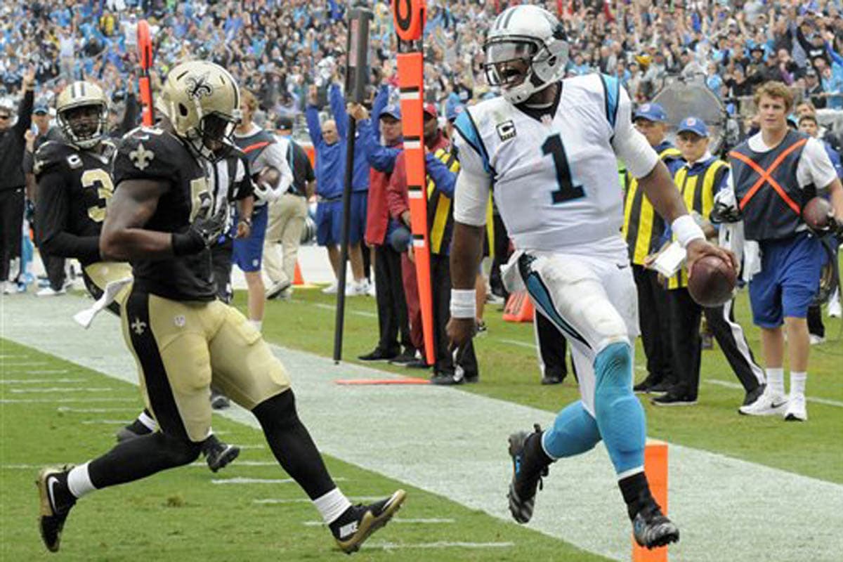 Cam Newton lanzó para 315 yardas y dos TDs para que los Panthers se llevaran el triunfo 27-22 sobre los Saints.