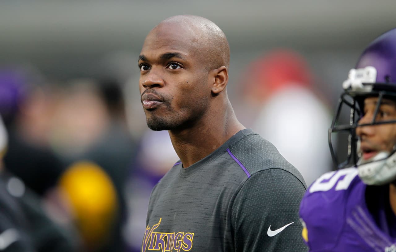 Injured Minnesota Vikings running back Adrian Peterson watches from the sideline during the second half of an NFL football game against the Chicago Bears Sunday, Jan. 1, 2017, in Minneapolis. The Vikings won 38-10. (AP Photo/Andy Clayton-King)