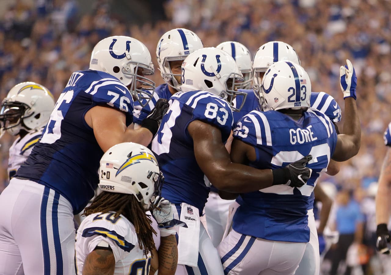 Indianapolis Colts' Frank Gore celebrates with teammates after running six-yards for a touchdown during the first half of an NFL football game against the San Diego Chargers, Sunday, Sept. 25, 2016, in Indianapolis. (AP Photo/AJ Mast)