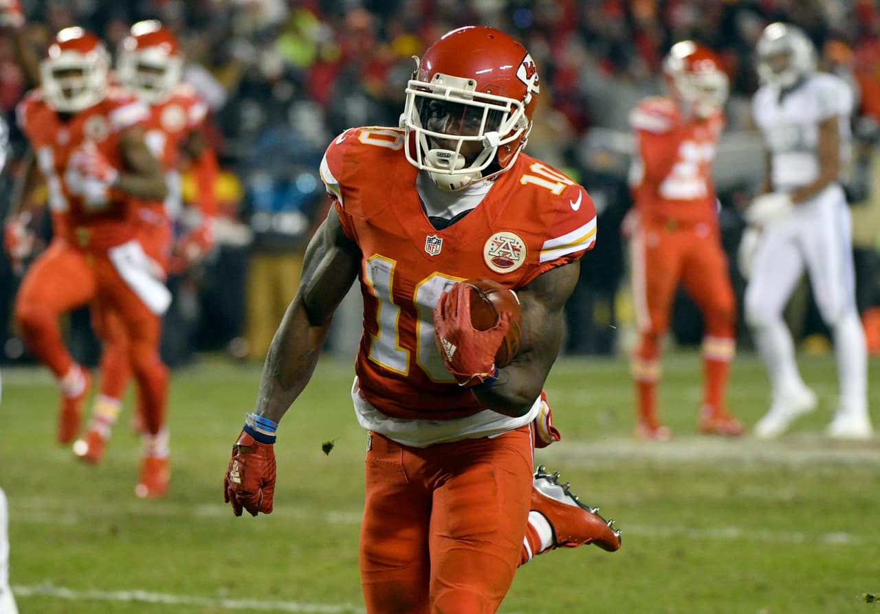 Kansas City Chiefs wide receiver Tyreek Hill (10) runs for a touchdown on a 78-yard kickoff return during the first half of an NFL football game against the Oakland Raiders in Kansas City, Mo., Thursday, Dec. 8, 2016. (AP Photo/Ed Zurga)