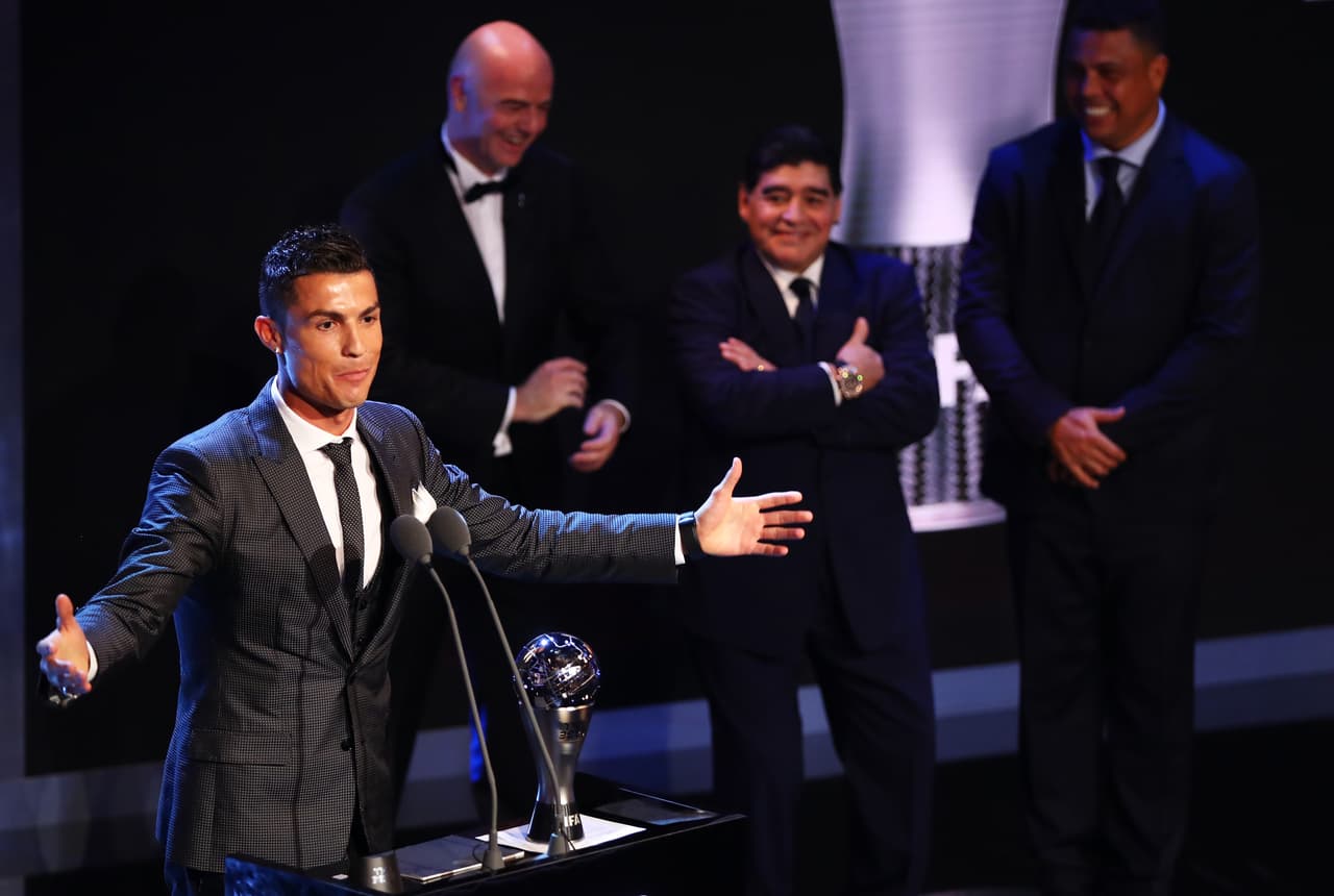LONDON, ENGLAND - OCTOBER 23: Cristiano Ronaldo of Portugal and Real Madrid CF wins The best Fifa men's player as Diego Maradona, Gianni Infantino and Ronaldo look on during The Best FIFA Football Awards Show on October 23, 2017 in London, England. (Photo by Michael Steele/Getty Images)