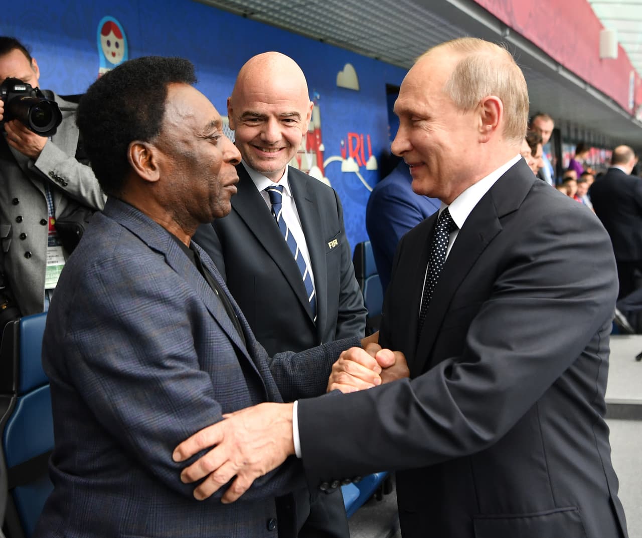 SAINT PETERSBURG, RUSSIA - JUNE 17: Russian President Vladimir Putin is greeted by Brazilian football legend Pele as FIFA president Gianni Infantino looks on prior to the FIFA Confederations Cup Group A match between Russia and New Zealand at Saint Petersburg Stadium on June 17, 2017 in Saint Petersburg, Russia. (Photo by Stuart Franklin - FIFA/FIFA via Getty Images)