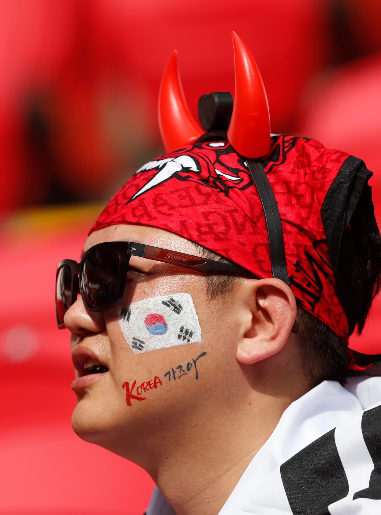 A football fan sits in the stands ahead of the group F match between South Korea and Germany, at the 2018 soccer World Cup in the Kazan Arena in Kazan, Russia, Wednesday, June 27, 2018. (AP Photo/Frank Augstein)