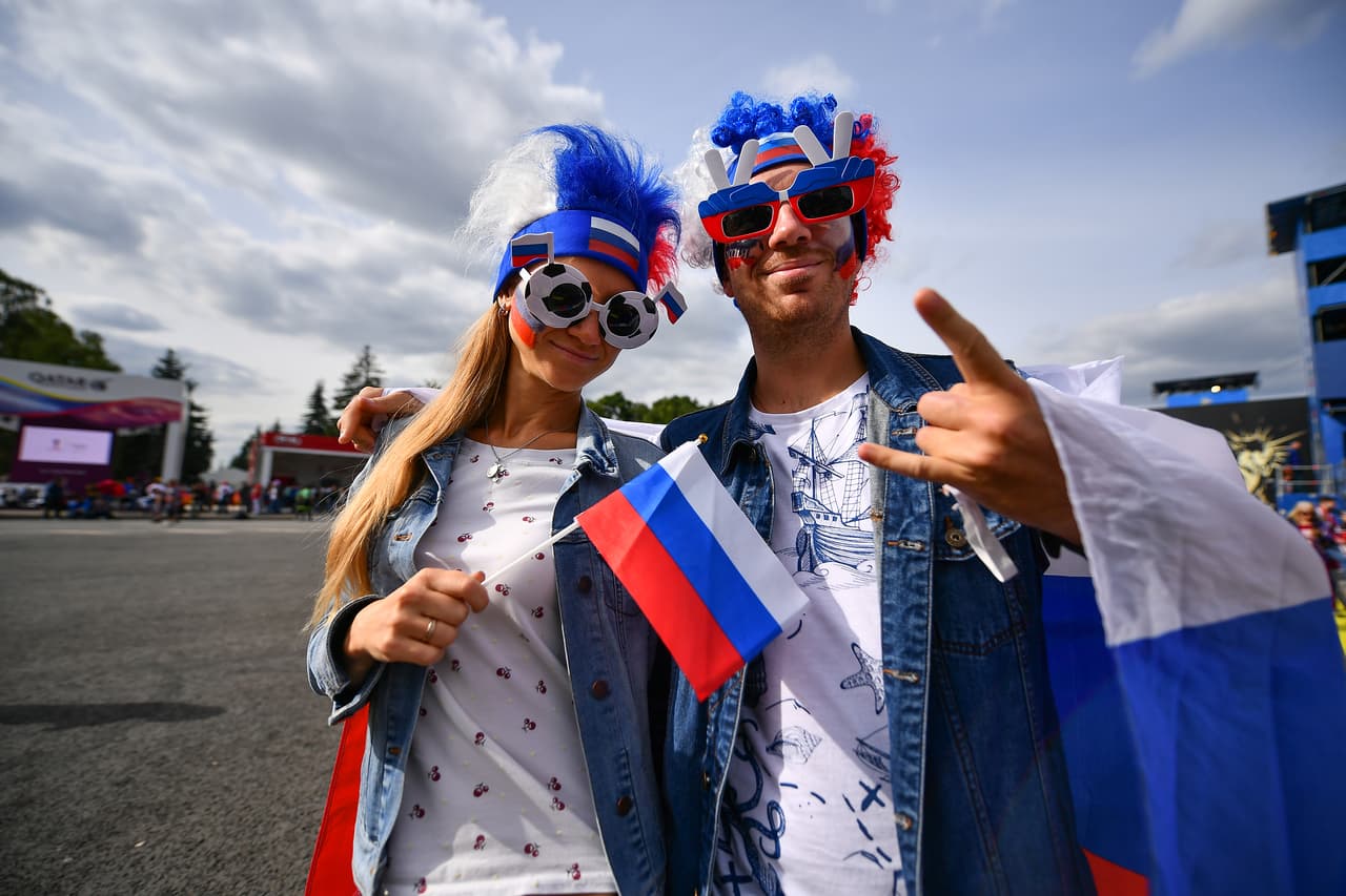 MOSCOW, RUSSIA - JUNE 14: Fans of Russia pose during the 2018 FIFA World Cup Russia group A match between Russia and Saudi Arabia at FIFA Fans Fest Moscow on June 14, 2018 in Moscow, Russia. (Photo by Hector Vivas/Getty Images)