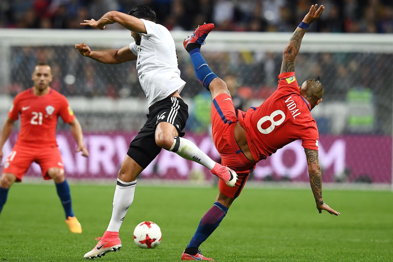 Germany's midfielder Emre Can (L) vies with Chile's midfielder Arturo Vidal during the 2017 Confederations Cup group B football match between Germany and Chile at the Kazan Arena Stadium in Kazan on June 22, 2017. / AFP PHOTO / FRANCK FIFE (Photo credit should read FRANCK FIFE/AFP/Getty Images)