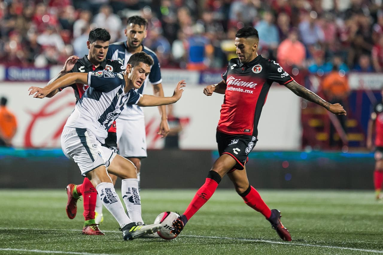 Action photo during the match Tijuana vs Monterrey, Corresponding 3st round of the Tournamente Apertura 2017 of the Liga MX Bancomer at Estadio Caliente. Foto de accion durante el partido Tijuana vs Monterrey, Correspondiente a la Jornada 3 del Torneo Apertura 2017 de la Liga BBVA Bancomer MX, en el Estadio Caliente, en la foto: Cesar Montes de Monterrey y Juan Lucero de Tijuana 04/08/2017/MEXSPORT/Emiliano.