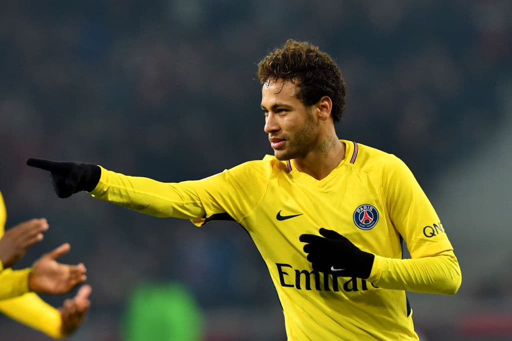 Paris Saint-Germain's Brazilian forward Neymar celebrates after scoring a goal during French L1 football match between Lille Losc and Paris Saint-Germain (PSG), at the Pierre-Mauroy stadium, in Villeneuve-d'Ascq, on February 3, 2018. / AFP PHOTO / DENIS CHARLET (Photo credit should read DENIS CHARLET/AFP/Getty Images)