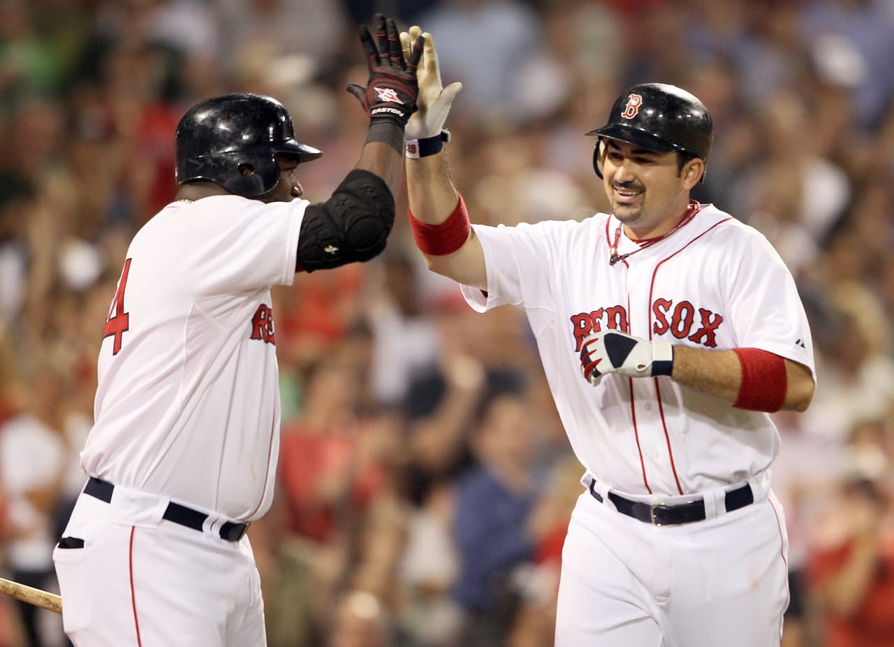 En 2011 los Medias Rojas de Boston abrieron la chequera y firmaron a Adrián. Tuvo en su primer año con los Red Sox su mejor cifra de hits con 213, 27 jonrones, 117 empujadas y un grueso .338 de bateo.