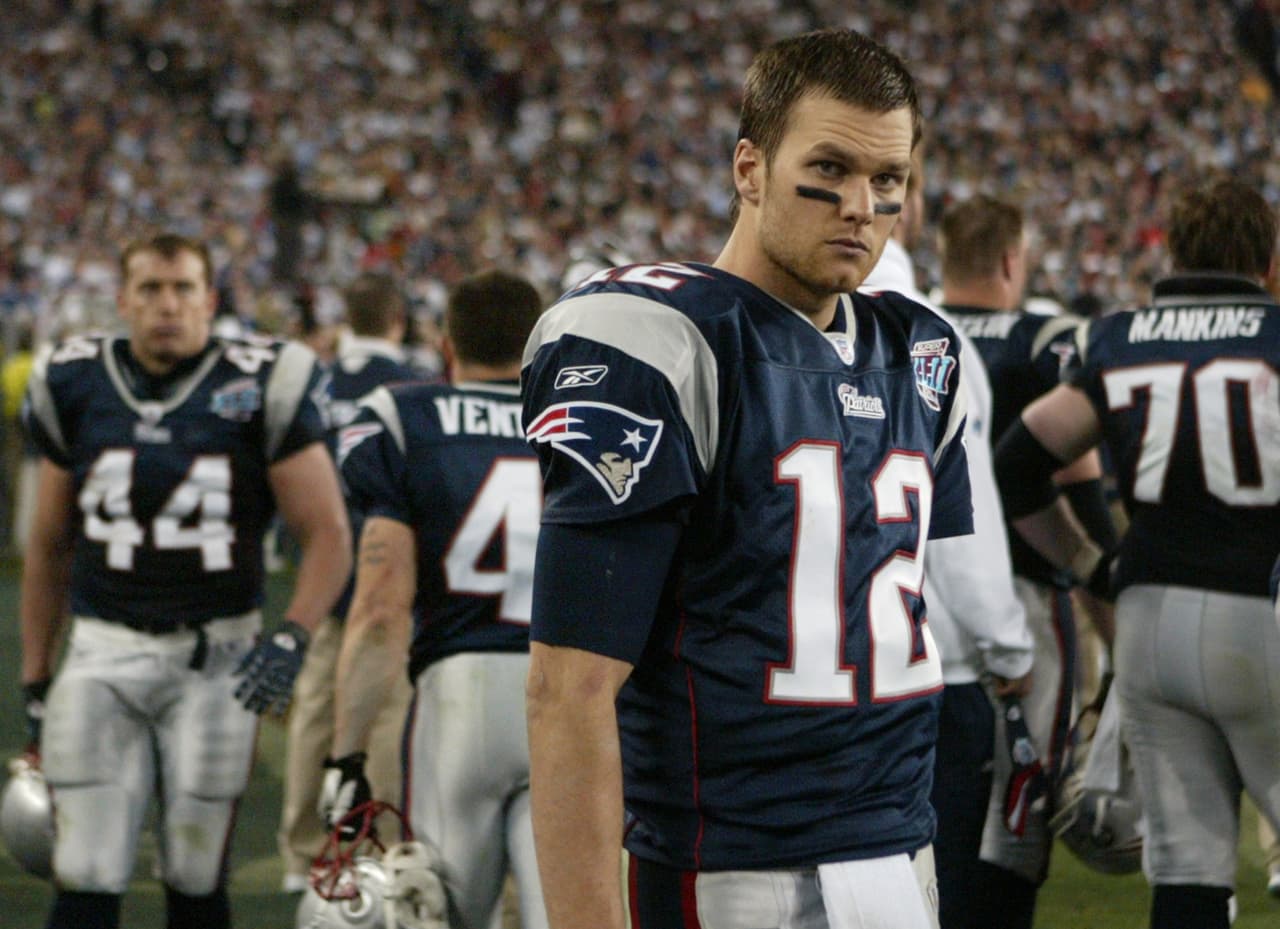 New England Patriots quarterback Tom Brady (12) looks on during the fourth quarter of the Super Bowl XLII football game against the New York Giants at University of Phoenix Stadium on Sunday, Feb. 3, 2008 in Glendale, Ariz. (AP Photo/Stephan Savoia)
