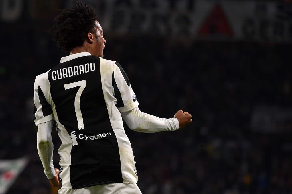 TURIN, ITALY - MARCH 31: Juan Cuadrado of Juventus celebrates after scoring his team's third goal during the serie A match between Juventus and AC Milan at Allianz Stadium on March 31, 2018 in Turin, Italy. (Photo by Tullio M. Puglia/Getty Images )