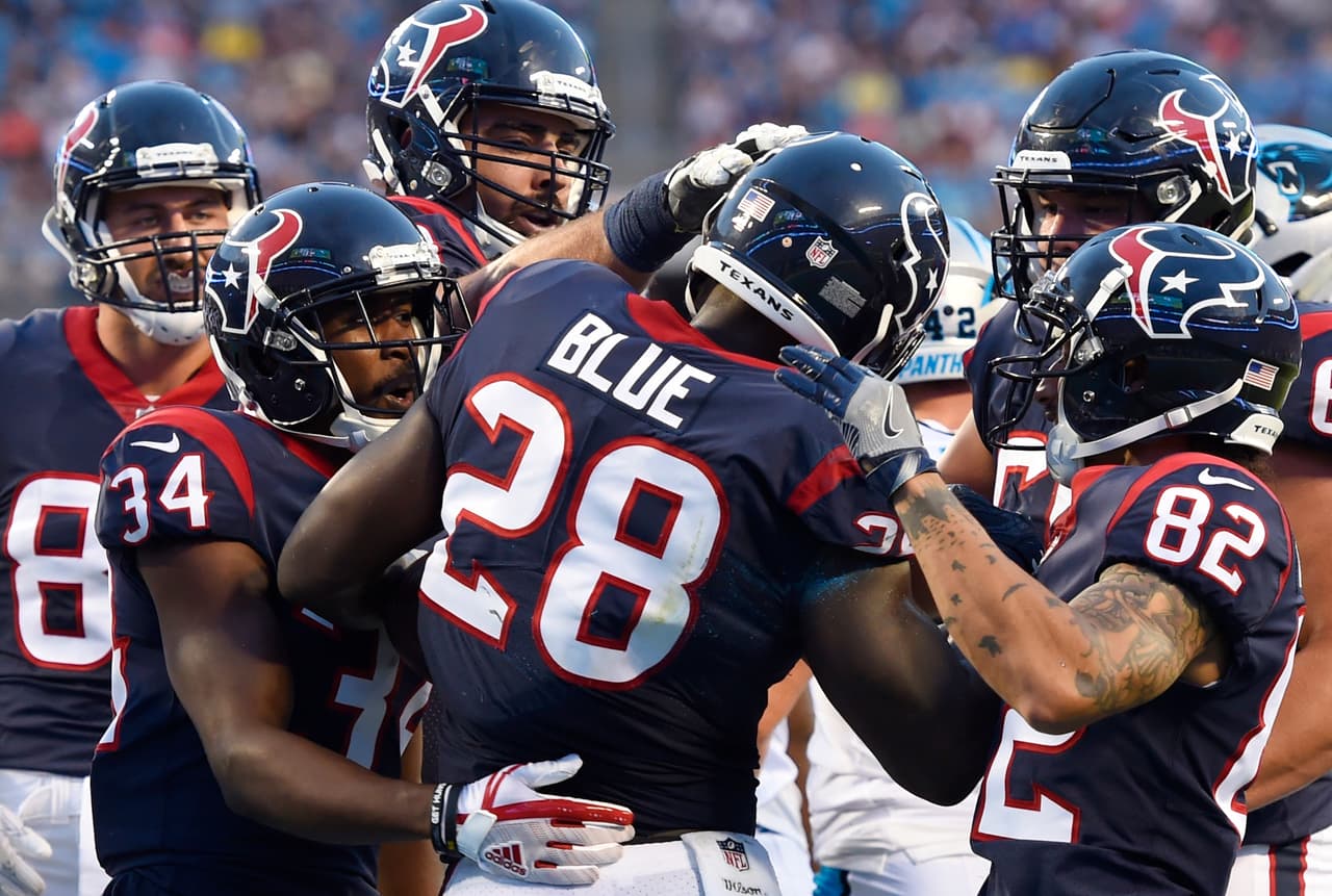 Houston Texans running back Alfred Blue (28) celebrates his touchdown with team mates against the Carolina Panthers during the first half of an NFL preseason football game, Wednesday, Aug. 9, 2017, in Charlotte, N.C. (AP Photo/Mike McCarn)