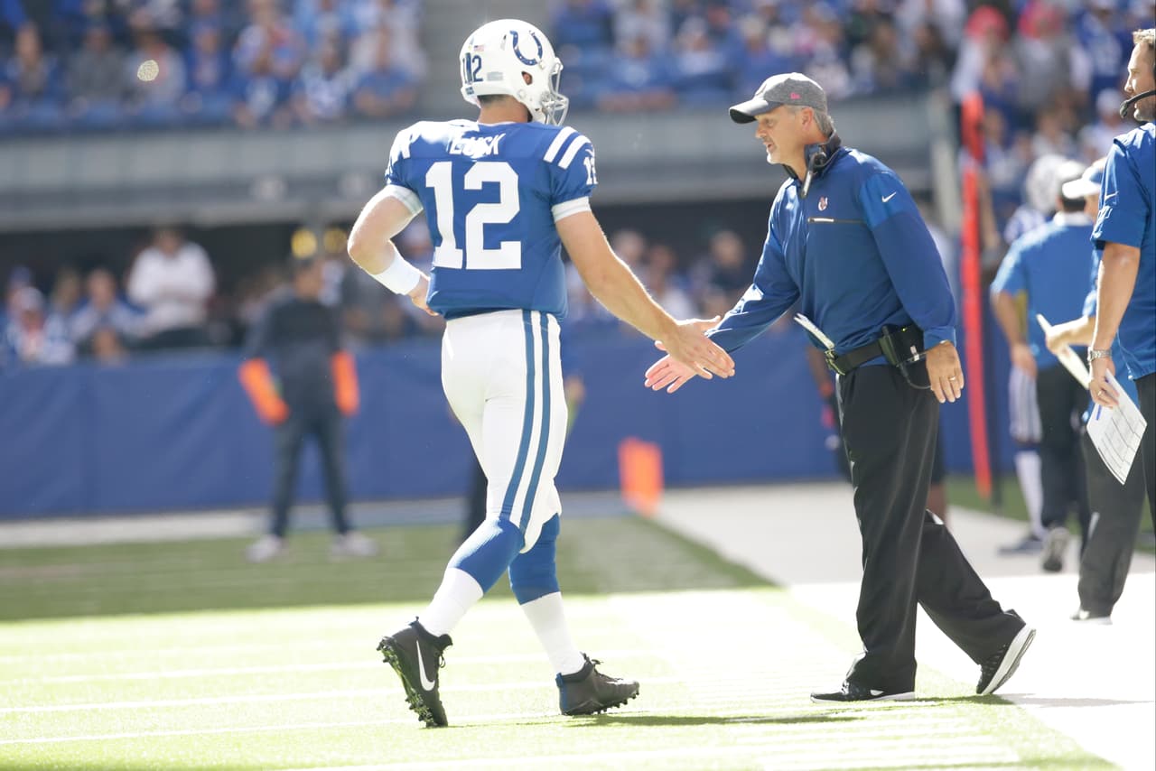 Indianapolis Colts head coach Chuck Pagano congratulates Indianapolis Colts quarterback Andrew Luck (12) after a touchdown against the Chicago Bears during the first half of an NFL football game in Indianapolis, Sunday, Oct. 9, 2016. (AP Photo/AJ Mast)
