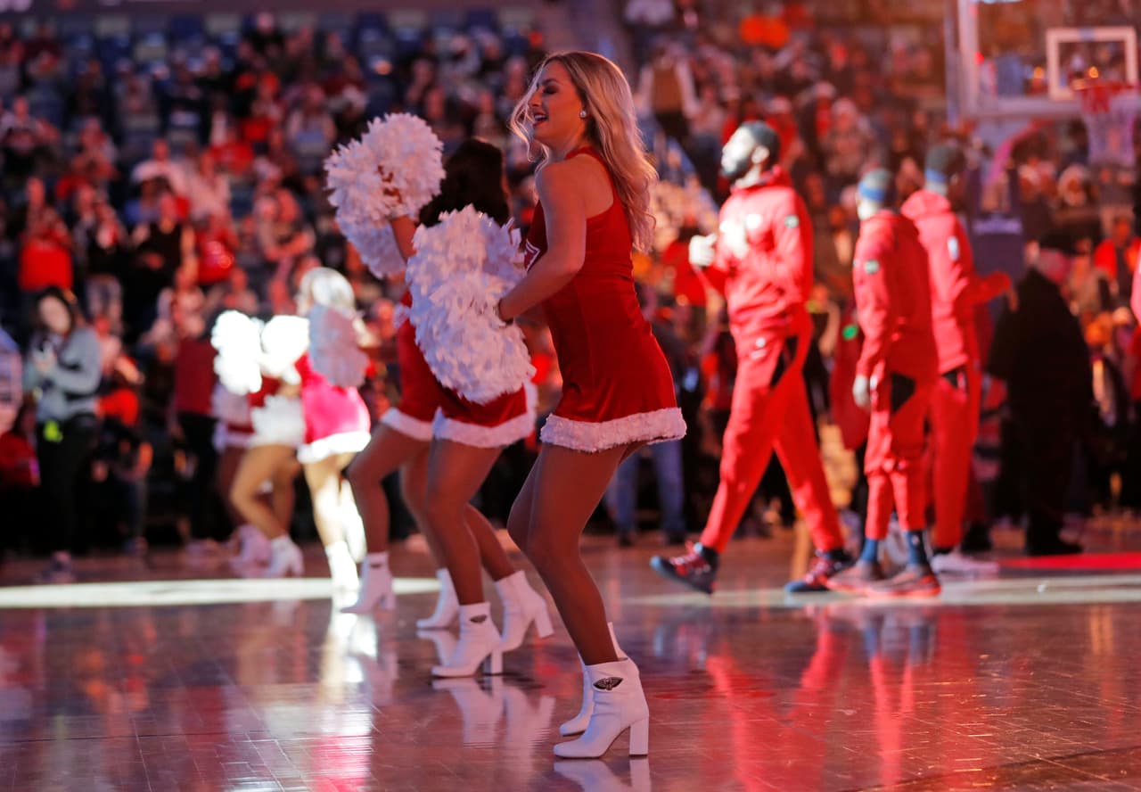 New Orleans Pelicans cheerleaders perform in Christmas costumes before an NBA basketball game against the Miami Heat in New Orleans, Sunday, Dec. 16, 2018. (AP Photo/Gerald Herbert)