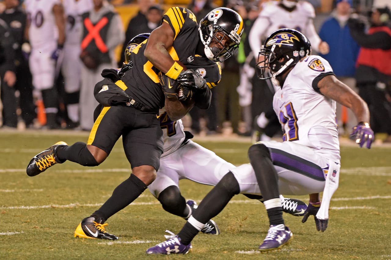 Pittsburgh Steelers wide receiver Antonio Brown (84) is tackled by Baltimore Ravens cornerback Kyle Arrington (24) after making a catch during the second half of an NFL football game in Pittsburgh, Sunday, Dec. 25, 2016. (AP Photo/Fred Vuich)
