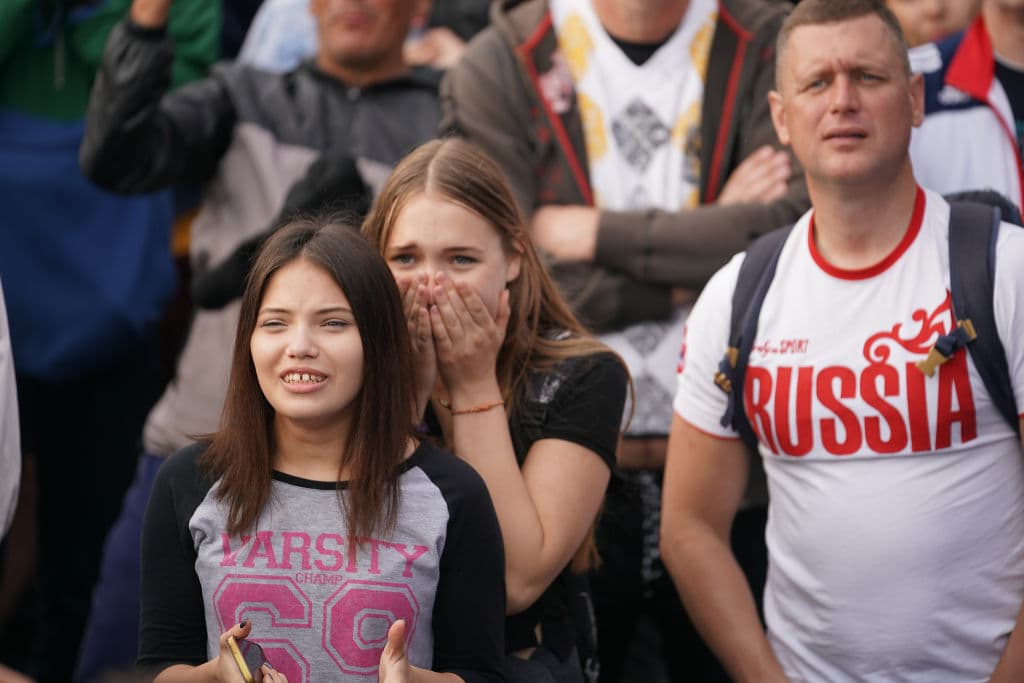 MOSCOW, RUSSIA - JUNE 14: Russia fans celebrate their team's second goal in the first World Cup match between Russia and Saudi Arabia at the official FIFA Fan Fest at Moscow State University on June 14, 2018 in Moscow, Russia. FIFA expects more than three billion viewers of the World Cup competition which begins today. (Photo by Christopher Furlong/Getty Images)