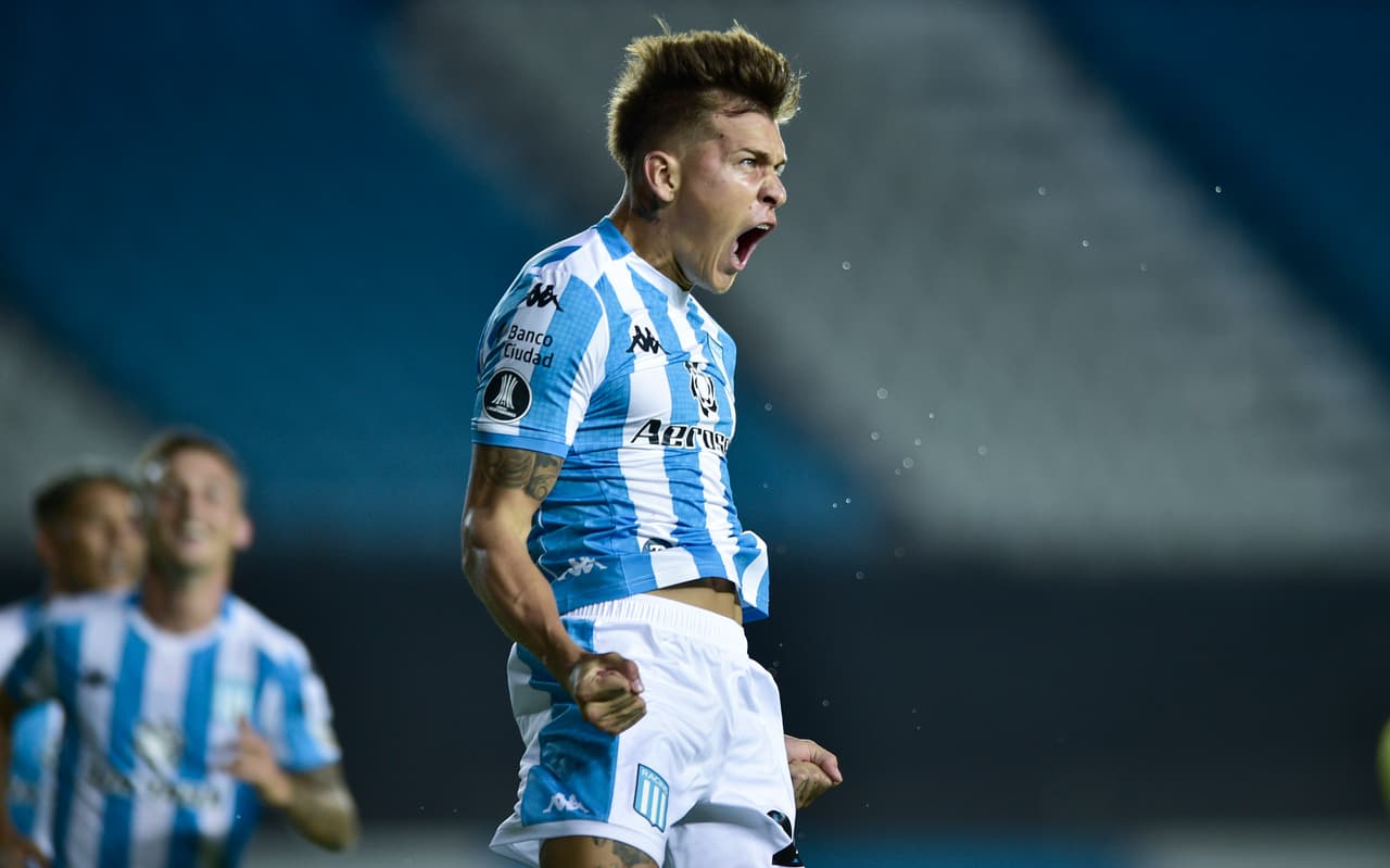 Gaston Reniero of Argentina's Racing Club celebrates scoring his side's opening goal during a Copa Libertadores soccer match against Peru's Alianza Lima in Buenos Aires, Argentina, Thursday, March 12, 2020. (AP Photo/Gustavo Garello)