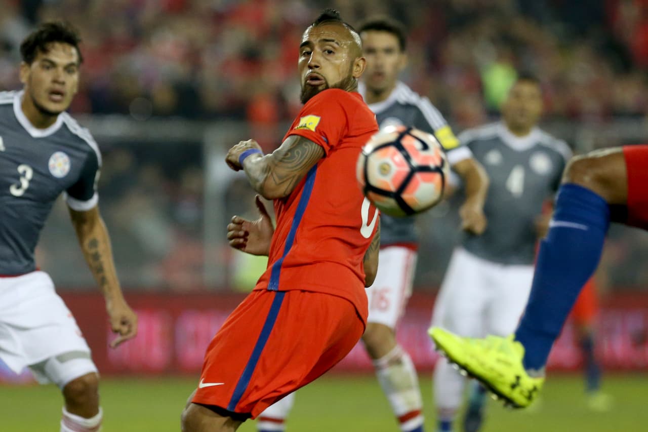 Chile's Arturo Vidal watches the ball during a 2018 World Cup qualifying soccer match against Paraguay in Santiago, Chile, Thursday, Aug. 31, 2017. (AP Photo/Esteban Felix)