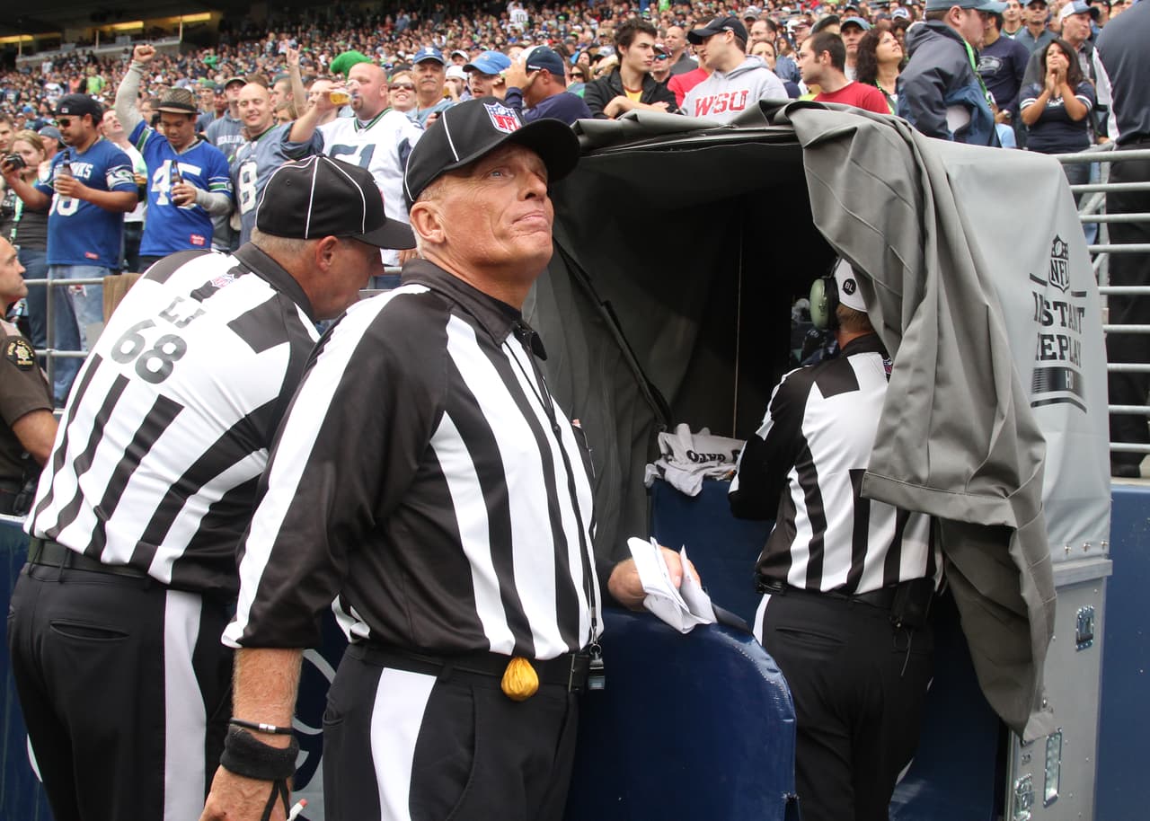 SEATTLE - SEPTEMBER 26: Referees review a play during the game between the Seattle Seahawks and the San Diego Chargers at Qwest Field on September 26, 2010 in Seattle, Washington. (Photo by Otto Greule Jr/Getty Images)