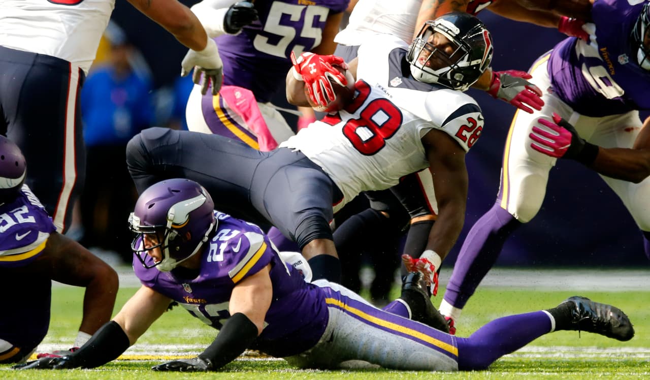 Houston Texans running back Alfred Blue (28) is tackled by Minnesota Vikings free safety Harrison Smith (22) during the second half of an NFL football game, Sunday, Oct. 9, 2016, in Minneapolis. The Vikings won 31-13. (AP Photo/Jim Mone)