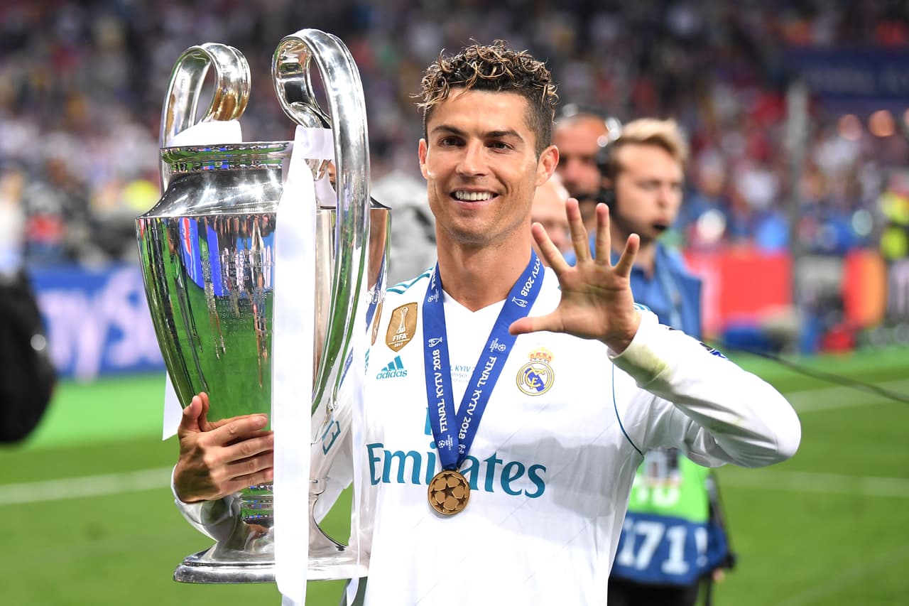 KIEV, UKRAINE - MAY 26: Cristiano Ronaldo of Real Madrid lifts The UEFA Champions League trophy following his sides victory in during the UEFA Champions League Final between Real Madrid and Liverpool at NSC Olimpiyskiy Stadium on May 26, 2018 in Kiev, Ukraine. (Photo by Laurence Griffiths/Getty Images)