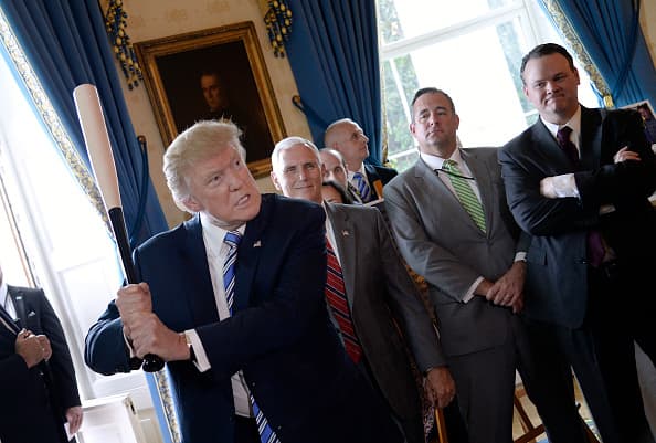 President Donald Trump swings a Marucci baseball bat in the Blue Room during a "Made in America" product showcase event at the White House in Washington, DC, on July 17, 2017. / AFP PHOTO / Olivier Douliery (Photo credit should read OLIVIER DOULIERY/AFP/Getty Images)