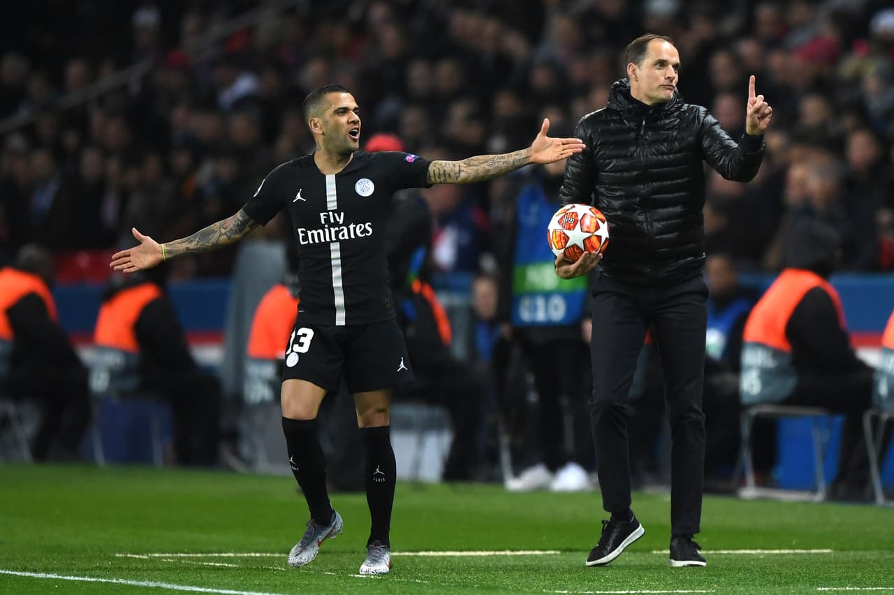 Thomas Tuchel, Manager of PSG and Dani Alves react during the UEFA Champions League Round of 16 Second Leg match between Paris Saint-Germain and Manchester United at Parc des Princes.