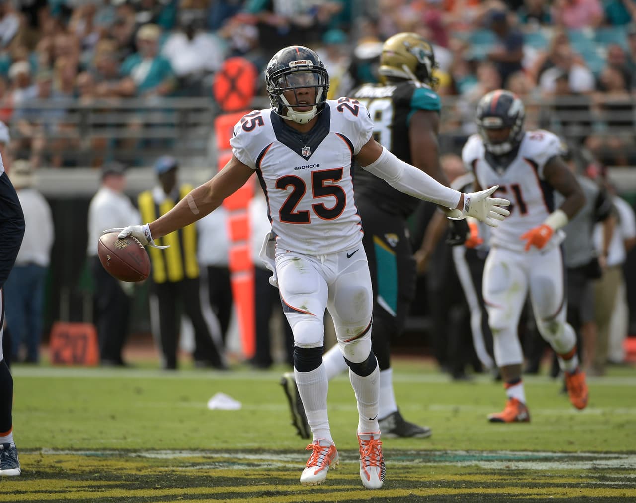 Jacksonville Jaguars wide receiver Marqise Lee (11) makes a reception as he is stopped by Denver Broncos cornerback Aqib Talib (21) during the first half of an NFL football game in Jacksonville, Fla., Sunday, Dec. 4, 2016. (AP Photo/Phelan M. Ebenhack)