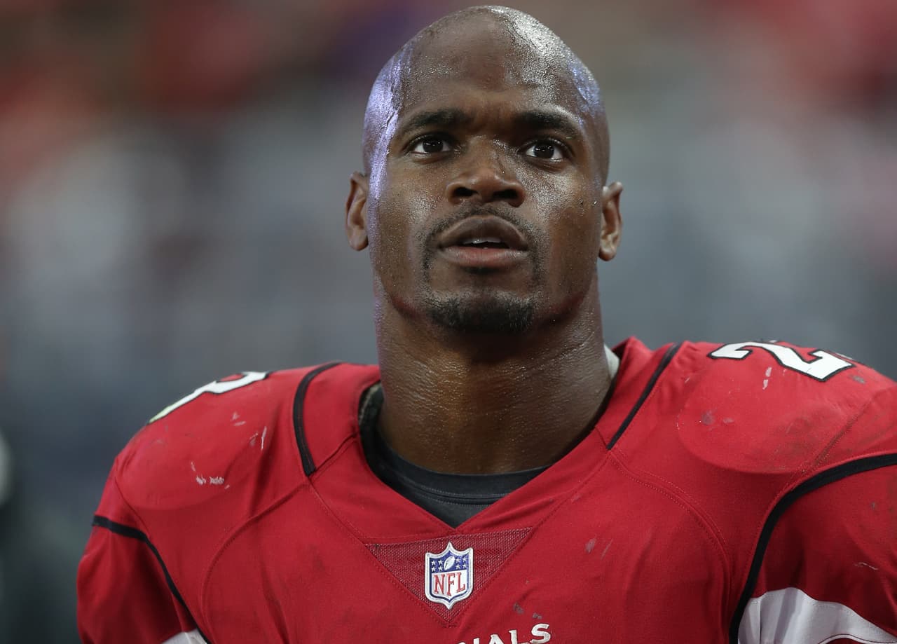 Arizona Cardinals running back Adrian Peterson (23) looks up from the sideline with his helmet off during a NFL football game against the Jacksonville Jaguars, Sunday, November 26, 2017 in Glendale, Ariz. The Cardinals won the game 27-24. (Paul Jasienski via AP)