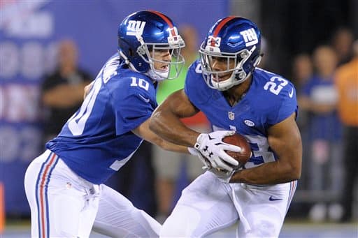 Eli Manning consiguió dos pases de touchdown en el primer triunfo de los Giants en la temporada al vencer 32-21 a los Redskins (AP-NFL).