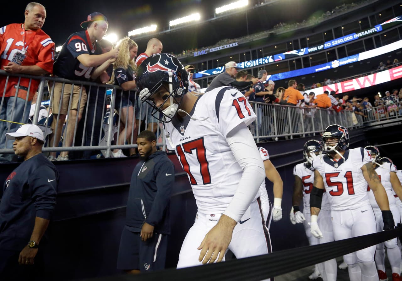 Houston Texans quarterback Brock Osweiler (17) leads the team onto the field for an NFL football game against the New England Patriots Thursday, Sept. 22, 2016, in Foxborough, Mass. (AP Photo/Elise Amendola)