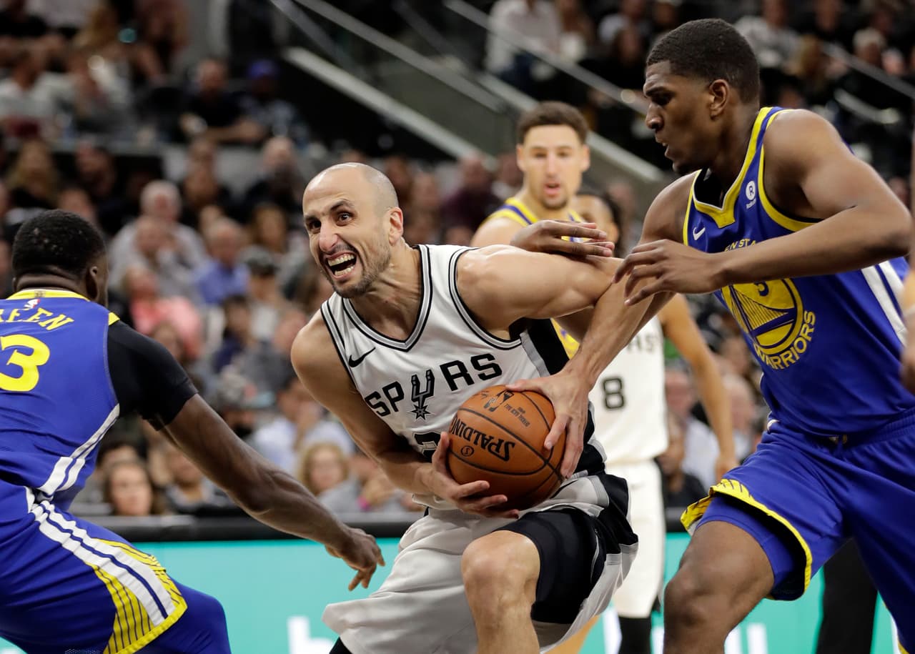 Golden State Warriors' Draymond Green (23) and Kevon Looney (5) defend against a drive to the basket by San Antonio Spurs' Manu Ginobili, center, during the first half of Game 3 of a first-round NBA basketball playoff series in San Antonio, Thursday, April 19, 2018. (AP Photo/Eric Gay)