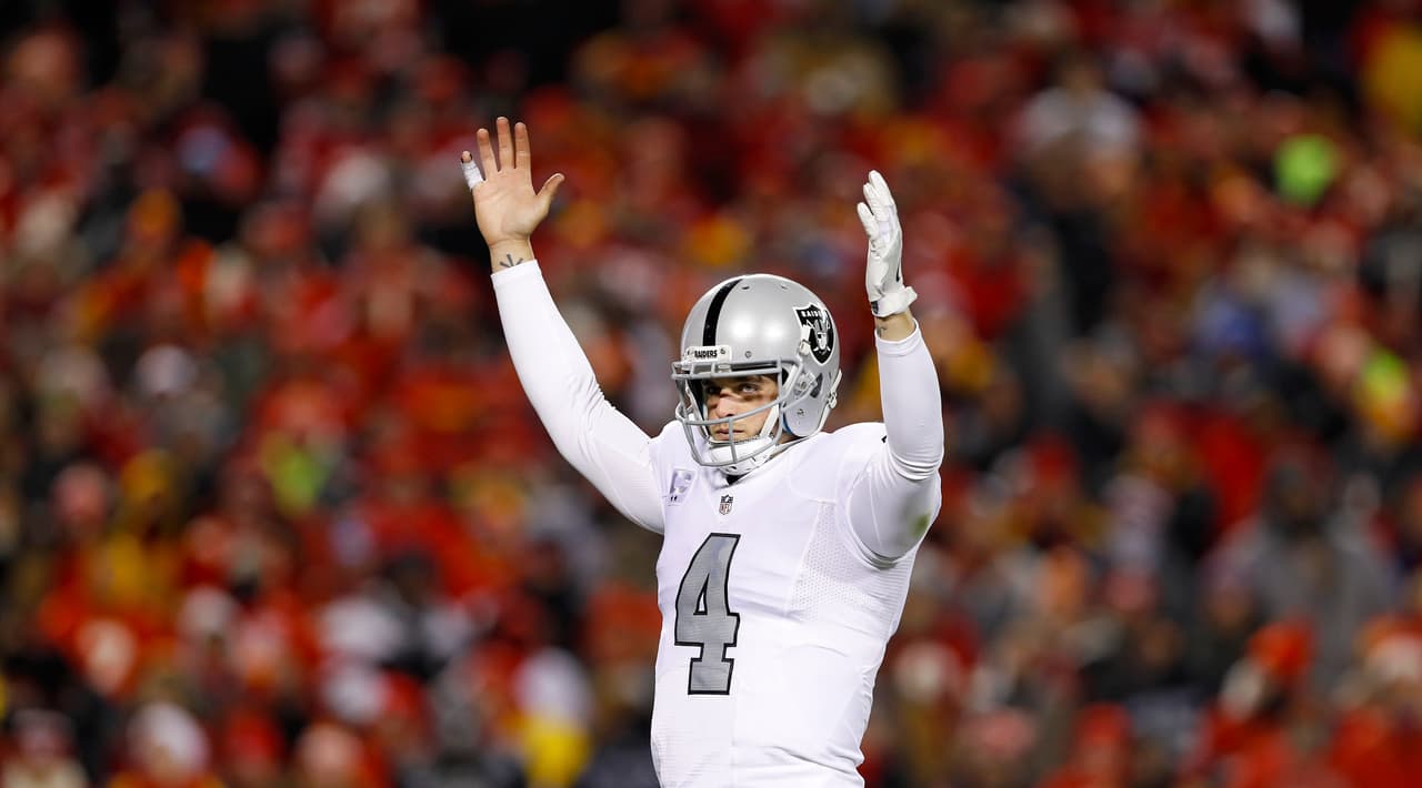 Oakland Raiders quarterback Derek Carr (4) celebrates after leading his team to a touchdown during an NFL football game against the Kansas City Chiefs on Thursday, Dec. 8, 2016 in Kansas City, Mo. Kansas City won 21-13. (Aaron M. Sprecher via AP)