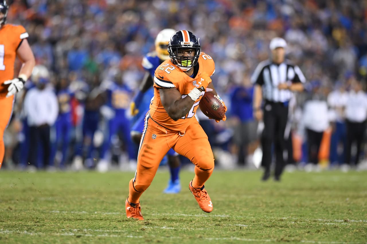 Denver Broncos running back C.J. Anderson (22) breaks open at midfield and carries for a 20 yard touchdown but the play was nullified by a holding penalty during fourth quarter action against the San Diego Chargers in the NFL game at Qualcomm Stadium in San Diego, Ca October 13, 2016. (Eric Bakke via AP)