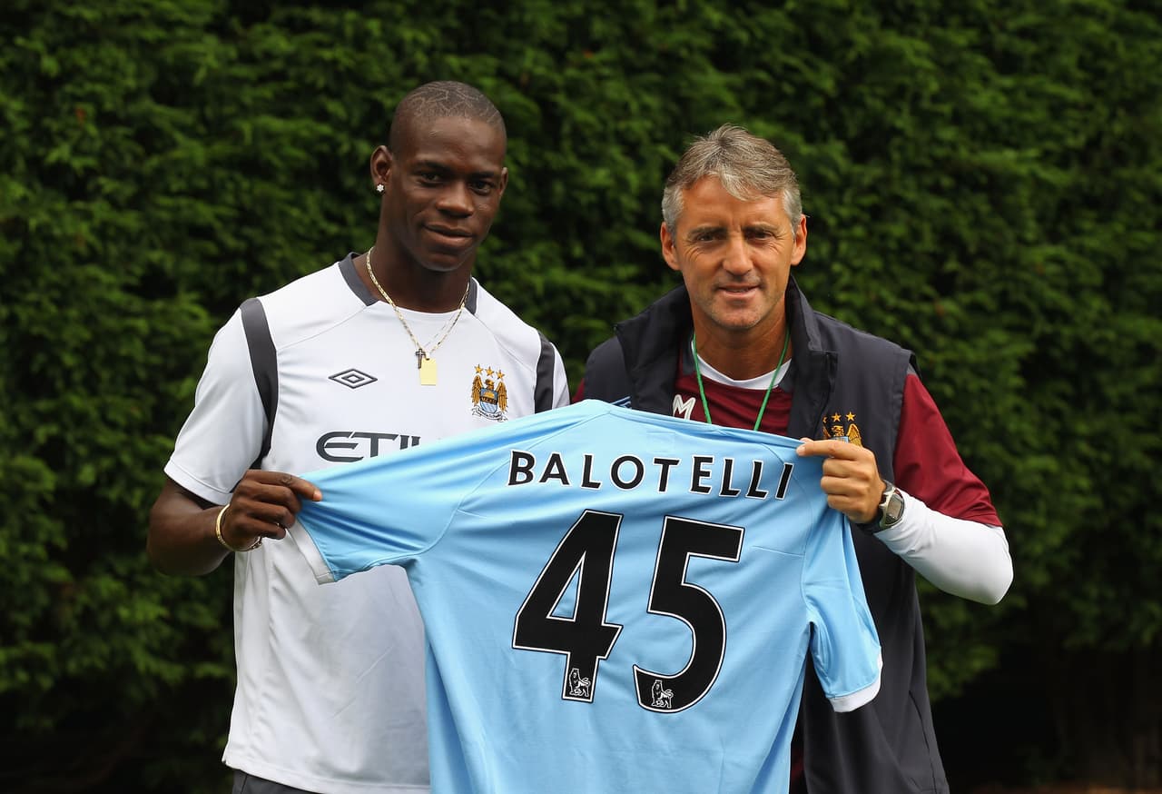 MANCHESTER, ENGLAND - AUGUST 17: Roberto Mancini the manager of Manchester City unveils his new signing, Mario Balotelli, at the Carrington Training Complex on August 17, 2010 in Manchester, England. (Photo by Alex Livesey/Getty Images)
