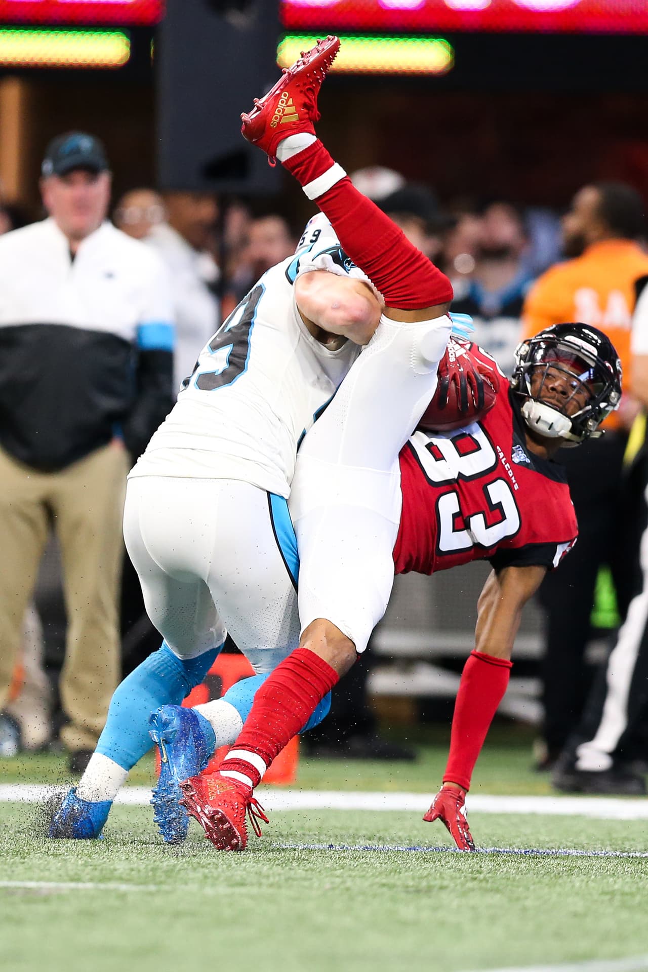 ATLANTA, GA - DECEMBER 8: Russell Gage #83 of the Atlanta Falcons makes a reception in front of defender Luke Kuechly #59 of the Carolina Panthers during the first half of the game at Mercedes-Benz Stadium on December 8, 2019 in Atlanta, Georgia. (Photo by Carmen Mandato/Getty Images)