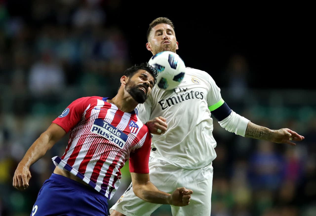 TALLINN, ESTONIA - AUGUST 15: Diego Costa of Atletico Madrid (R) and Sergio Ramos of Real Madrid compete for the ball during the UEFA Super Cup between Real Madrid and Atletico Madrid at Lillekula Stadium on August 15, 2018 in Tallinn, Estonia. (Photo by Alexander Hassenstein/Getty Images)