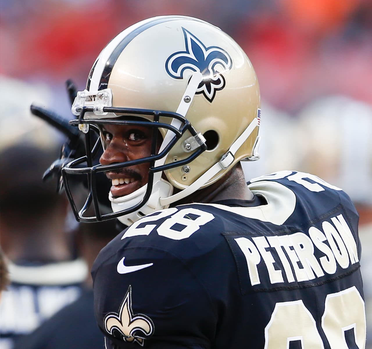 FILE - In this Aug. 10, 2017, file photo, file photo, New Orleans Saints running back Adrian Peterson stands on the sideline during warm ups before an NFL preseason football game against the Cleveland Browns, in Cleveland. The Saints open their season on Sept. 11 against Minnesota. (AP Photo/Ron Schwane, File)
