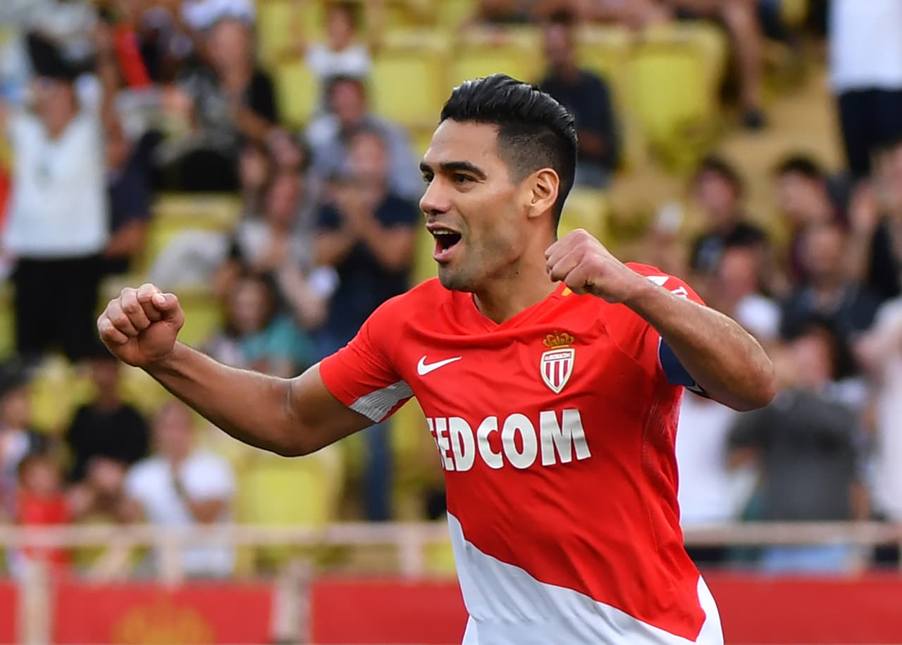 Monaco's Colombian forward Radamel Falcao celebrates after scoring his second goal during the French L1 football match Monaco (ASM) vs Strasbourg on September 16, 2017, at Louis II Stadium in Monaco. / AFP PHOTO / YANN COATSALIOU (Photo credit should read YANN COATSALIOU/AFP/Getty Images)