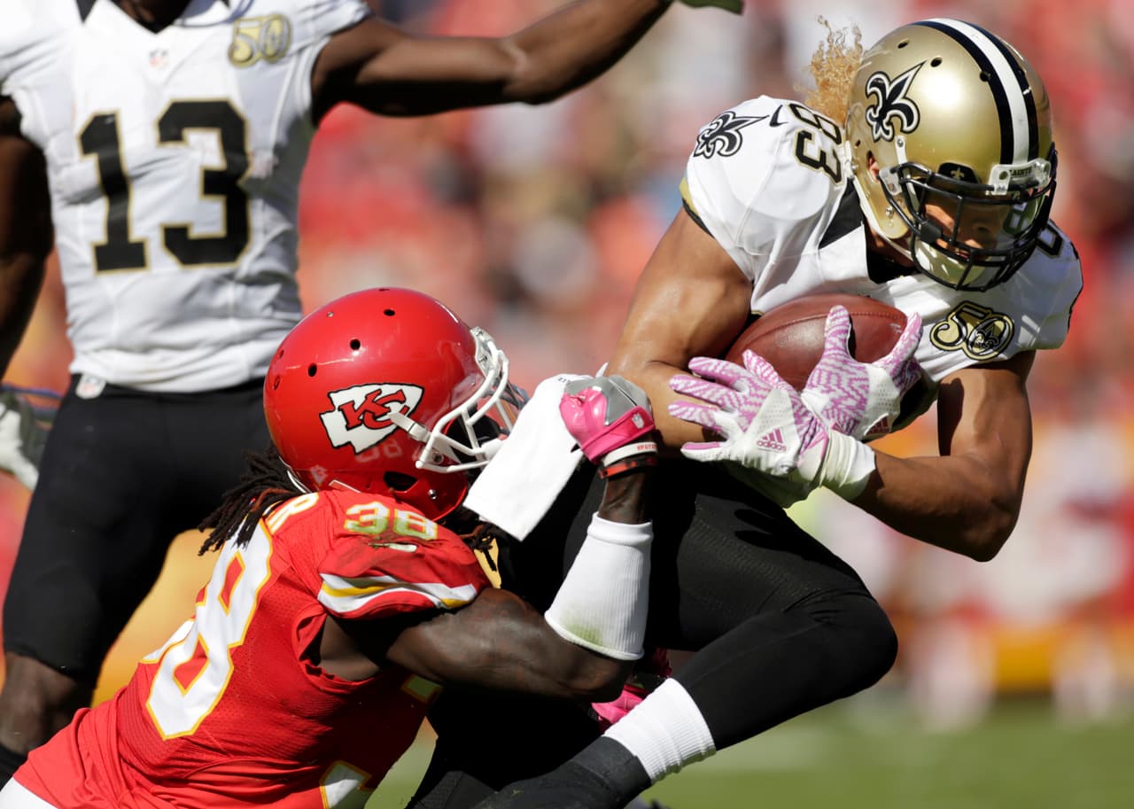 New Orleans Saints wide receiver Willie Snead IV (83) is tackled by Kansas City Chiefs defensive back Ron Parker (38) during the first half of an NFL football game in Kansas City, Mo., Sunday, Oct. 23, 2016. (AP Photo/Colin E. Braley)