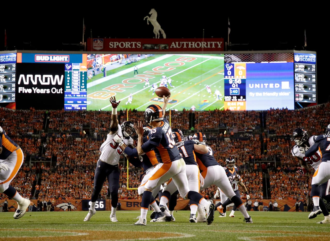Denver Broncos quarterback Trevor Siemian (13) throws against the Houston Texans during the first half of an NFL football game, Monday, Oct. 24, 2016, in Denver. (AP Photo/Jack Dempsey)