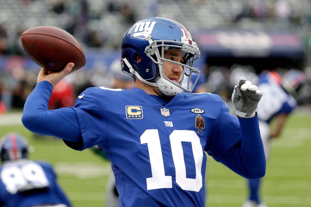 New York Giants quarterback Eli Manning works out prior to an NFL football game against the Philadelphia Eagles, Sunday, Dec. 17, 2017, in East Rutherford, N.J. (AP Photo/Seth Wenig)