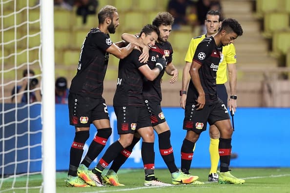Leverkusen's Mexican forward Javier Hernández Balcázar (2ndL) is congratulated by teammates after scoring a goal during the UEFA Champions League football match AS Monaco vs Bayer Leverkusen, on September 27, 2016 in Monaco. / AFP / Valery HACHE (Photo credit should read VALERY HACHE/AFP/Getty Images)