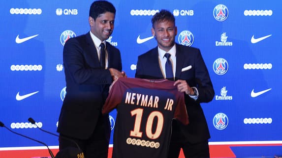 PARIS, FRANCE - AUGUST 04: Neymar of Paris Saint-Germain (PSG) reacts with president Nasser Al-Khelaifi during the press conference at Parc des Princes on August 4, 2017 in Paris, France. (Photo by Xavier Laine/Getty Images)