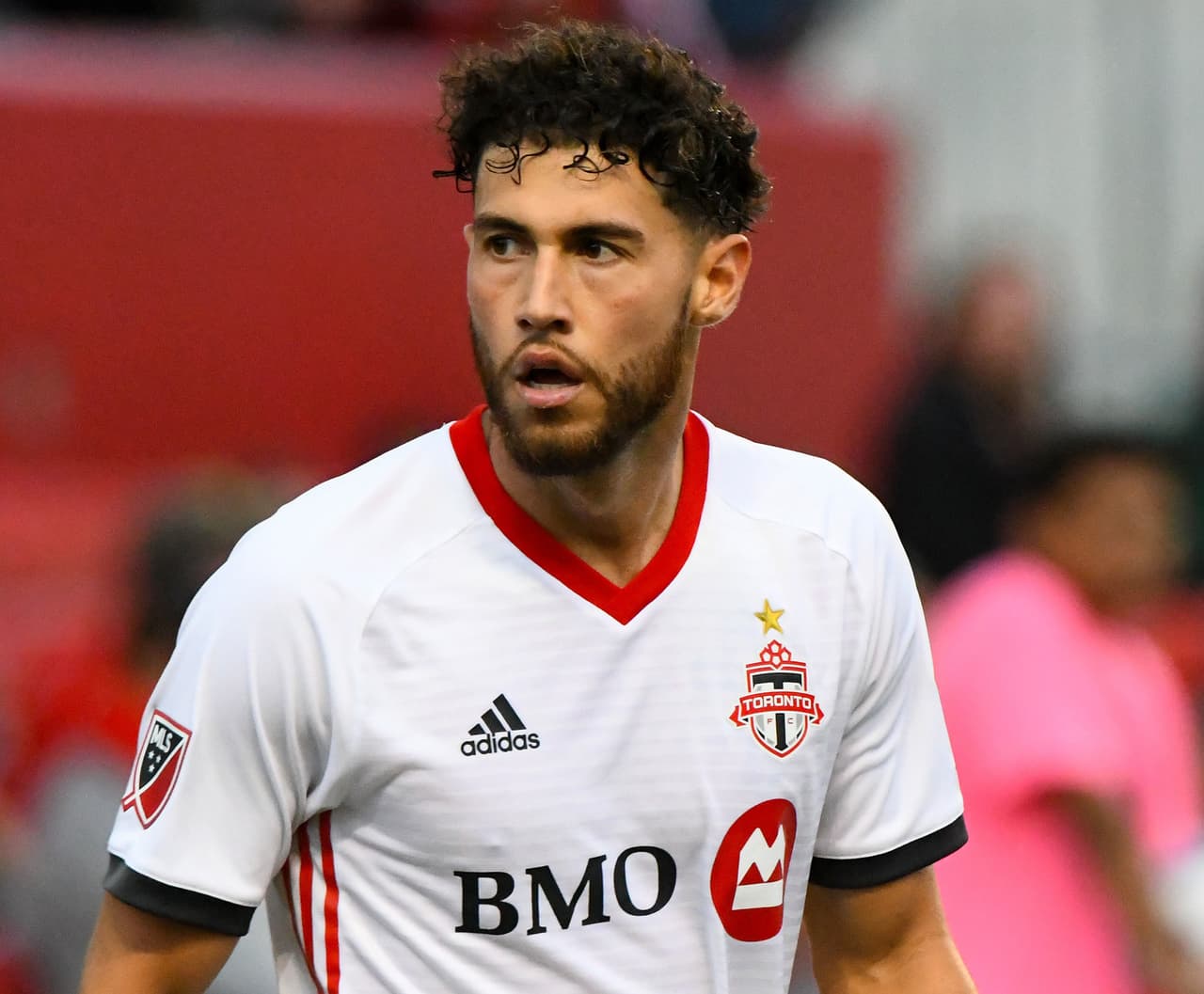 Jul 21, 2018; Chicago, IL, USA; Toronto FC midfielder Jonathan Osorio (21) reacts after scoring a goal against the Chicago Fire during the second half at Bridgeview Stadium. Mandatory Credit: Mike DiNovo-USA TODAY Sports