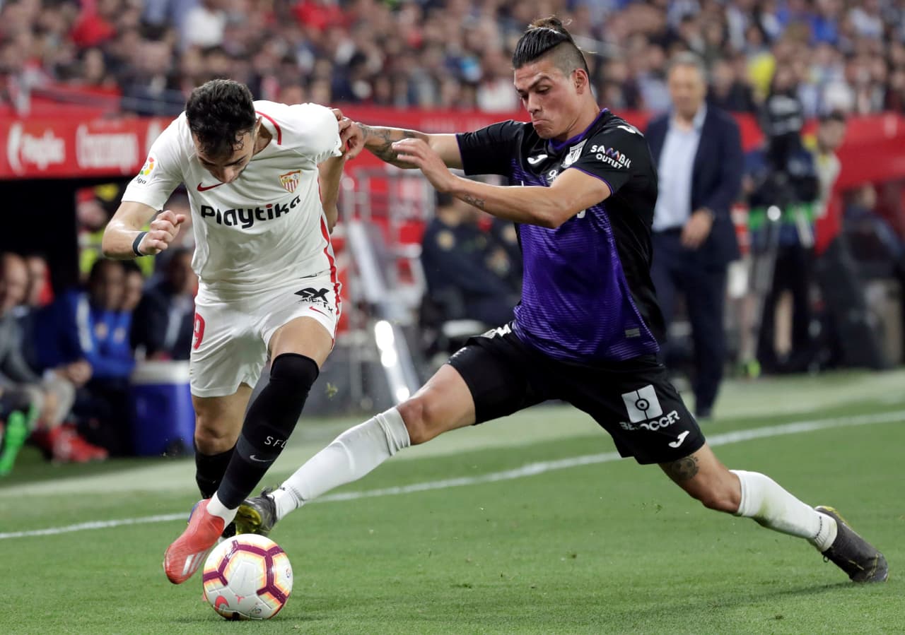 Tampoco el español Munir El Haddadi (izquierda) encontró el camino para anotar al menos un gol para el Sevilla.