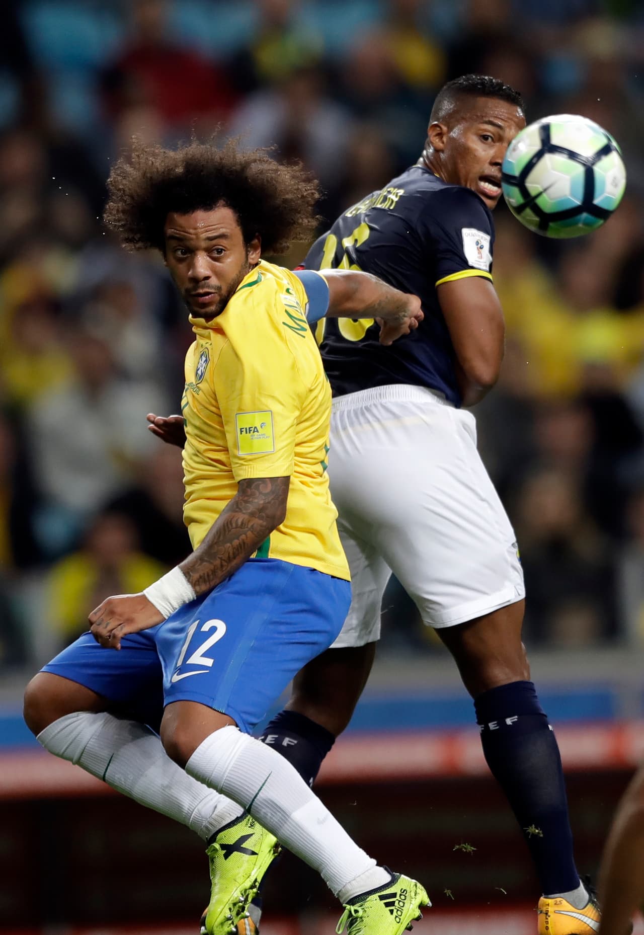 Brazil's Marcelo, left, goes for a header with Ecuador's Pedro Quinones during a 2018 World Cup qualifying soccer match in Porto Alegre, Brazil, Thursday, Aug. 31, 2017. (AP Photo/Andre Penner)